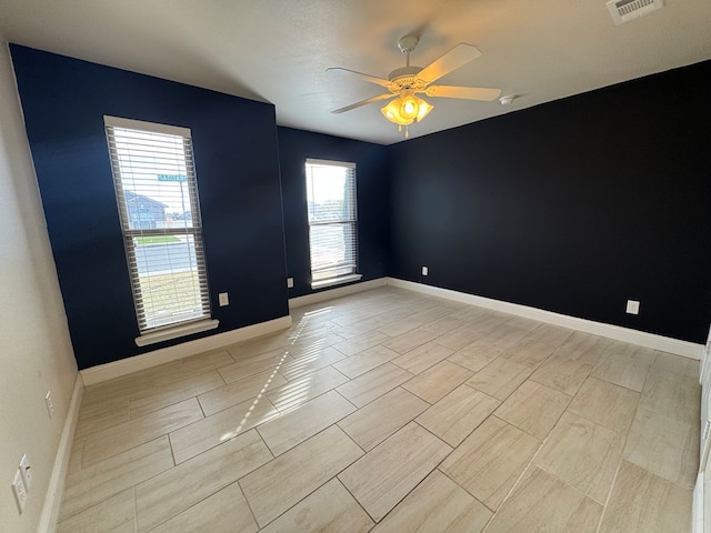 spare room featuring ceiling fan