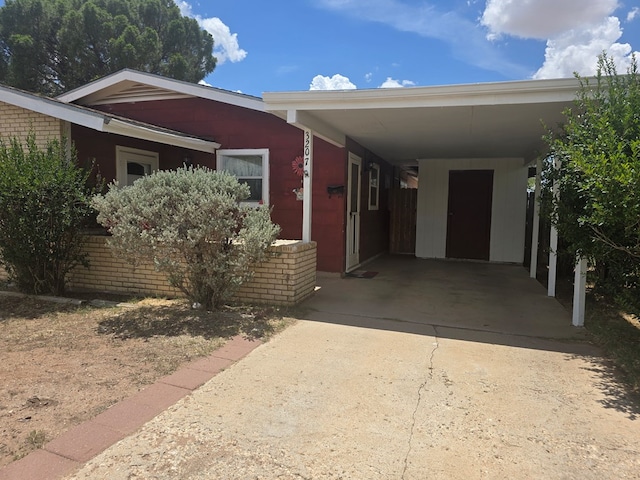 3207 Eastland Ave, Odessa, TX 79763 - view of front of house featuring driveway and an attached carport
