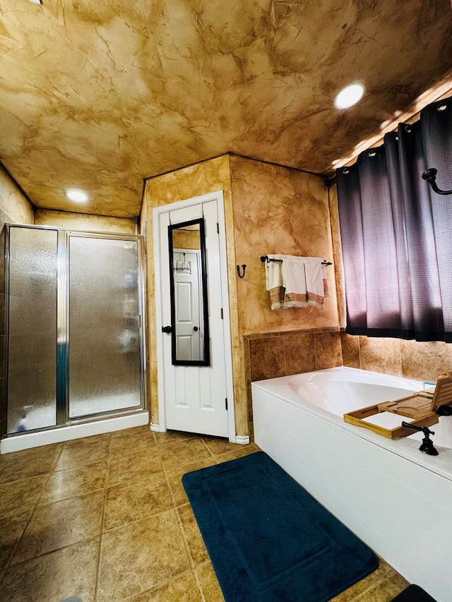 full bathroom featuring tile patterned flooring, a shower stall, a garden tub, and recessed lighting