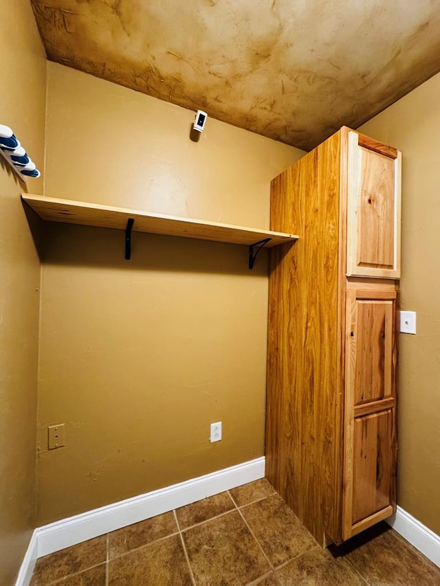 spacious closet featuring tile patterned floors