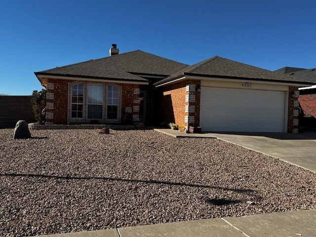 view of front of property featuring brick siding, concrete driveway, roof with shingles, a chimney, and a garage