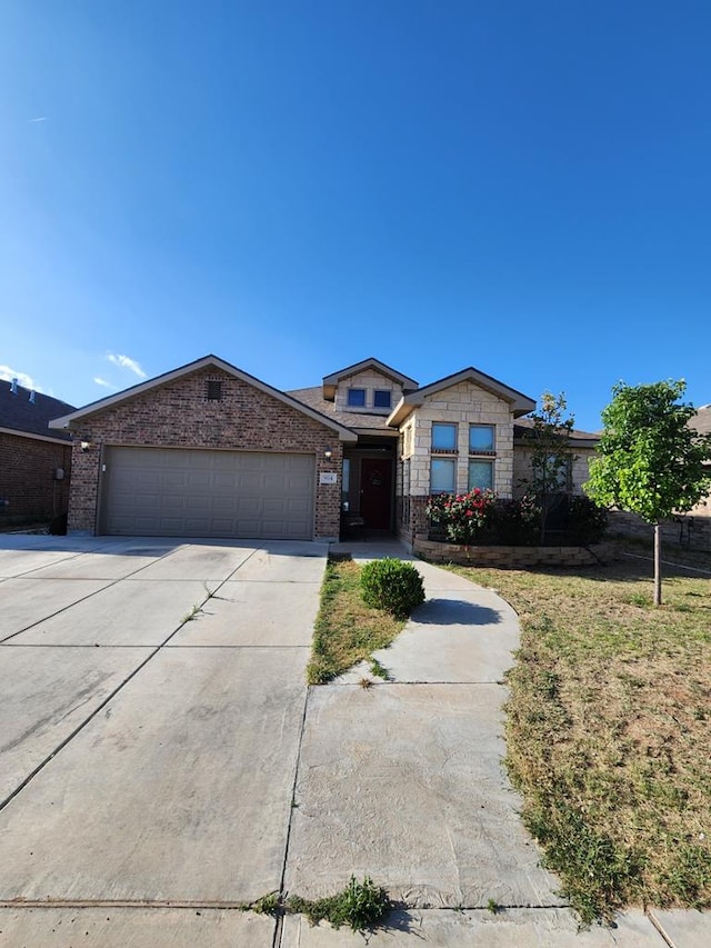 ranch-style home featuring a garage, stone siding, driveway, and brick siding