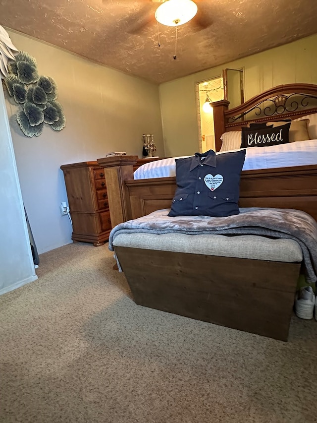 1001 Dorothea St, Crane, TX 79731 - bedroom with light colored carpet and a ceiling fan