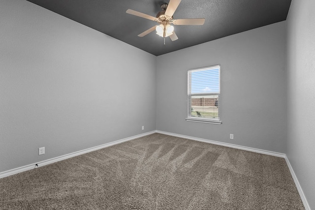 unfurnished room with carpet, baseboards, and a ceiling fan