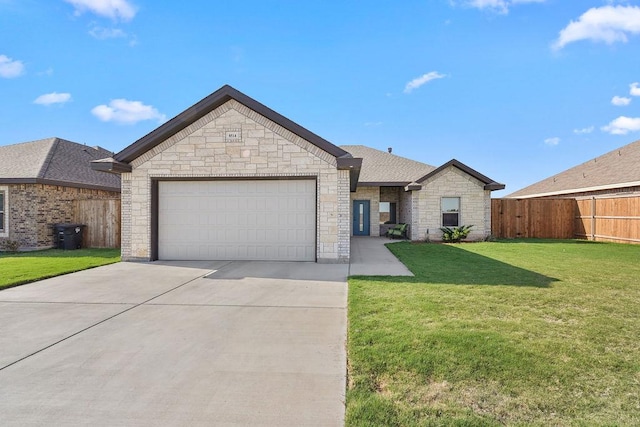ranch-style home with fence, an attached garage, stone siding, driveway, and a front lawn