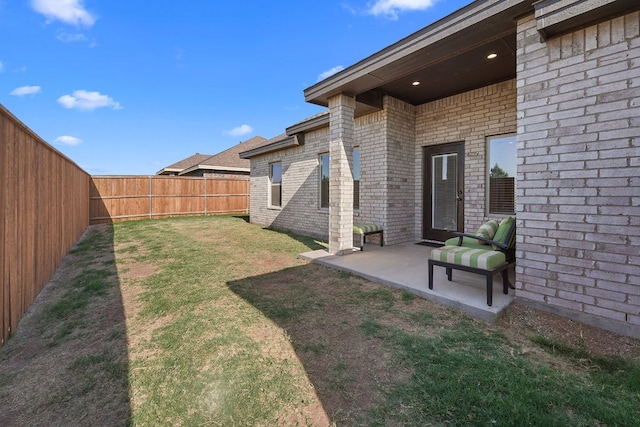 view of yard featuring a fenced backyard and a patio area