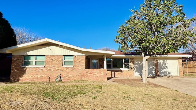 ranch-style home featuring a garage and a front yard