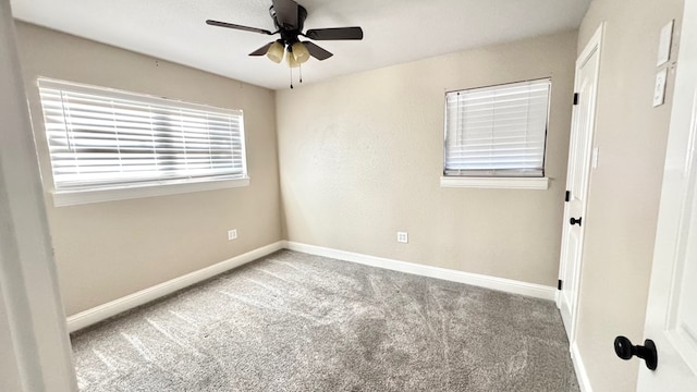 unfurnished room featuring ceiling fan and carpet floors