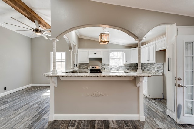 4503 Palmer Dr, Midland, TX 79705 - kitchen with stainless steel electric range, white cabinets, decorative backsplash, ceiling fan, and crown molding