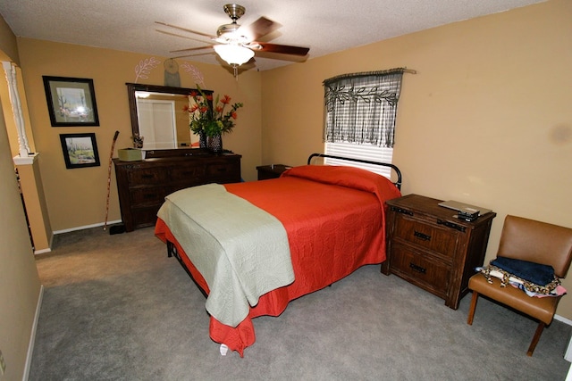 carpeted bedroom featuring a ceiling fan and baseboards