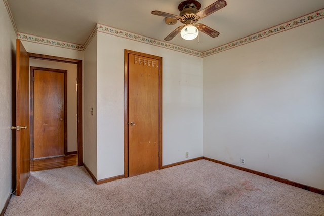 unfurnished bedroom featuring a closet, ceiling fan, and light carpet