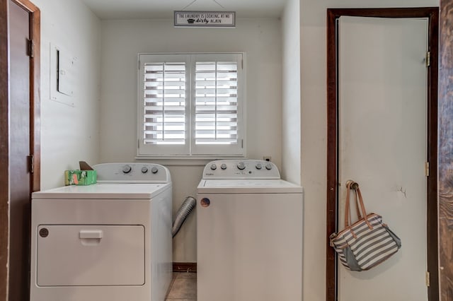 washroom featuring light tile patterned floors and separate washer and dryer