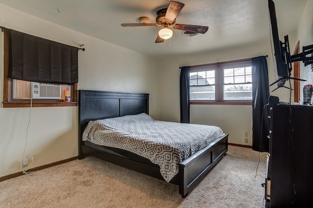 carpeted bedroom featuring cooling unit and ceiling fan