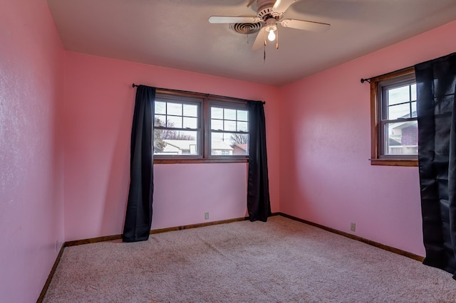 carpeted empty room with ceiling fan