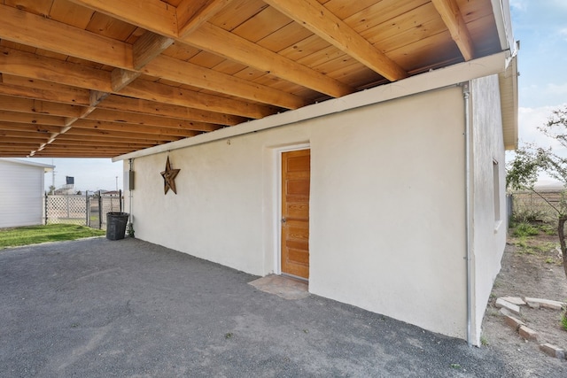 101 N 7th St, Marathon, TX 79842 - view of side of home featuring stucco siding and fence
