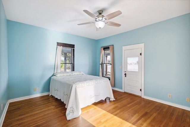 101 N 7th St, Marathon, TX 79842 - bedroom featuring baseboards, wood finished floors, and a ceiling fan