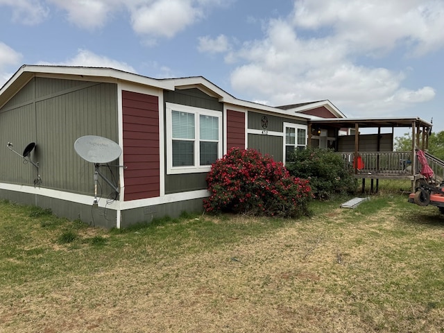 view of home's exterior with a yard and crawl space