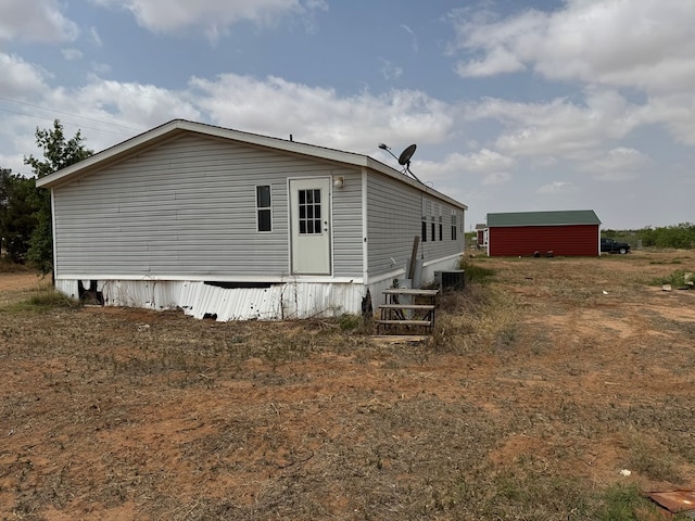 view of side of home featuring central air condition unit