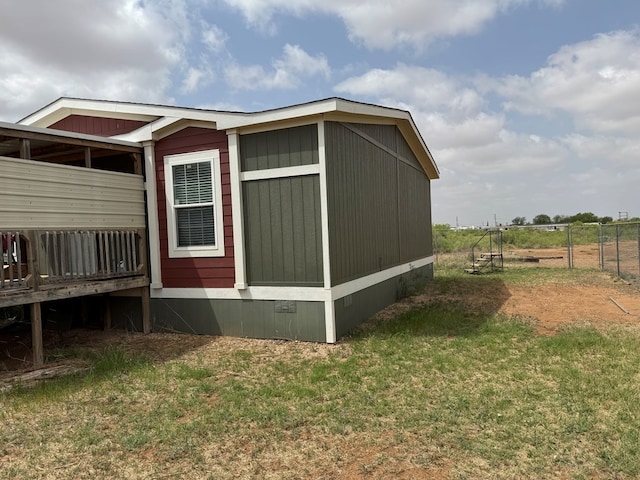 view of outdoor structure featuring fence