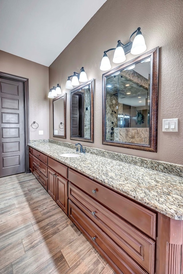 bathroom with vanity and hardwood / wood-style flooring