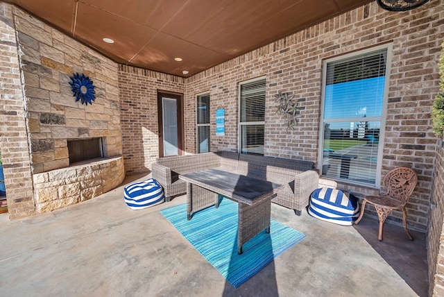 view of patio / terrace featuring an outdoor living space with a fireplace