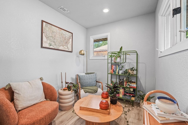 6338 Mecca St, Odessa, TX 79762 - sitting room with wood finished floors, recessed lighting, and a textured wall