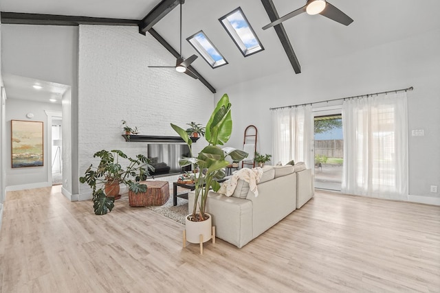 6338 Mecca St, Odessa, TX 79762 - living area featuring ceiling fan, a skylight, high vaulted ceiling, wood finished floors, and beam ceiling