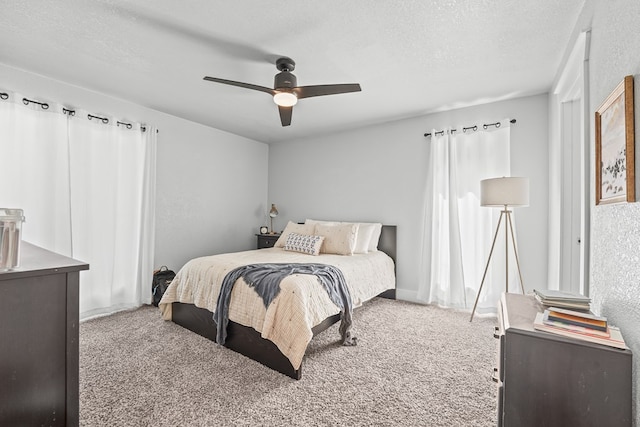 6338 Mecca St, Odessa, TX 79762 - bedroom with carpet flooring, a textured ceiling, and ceiling fan