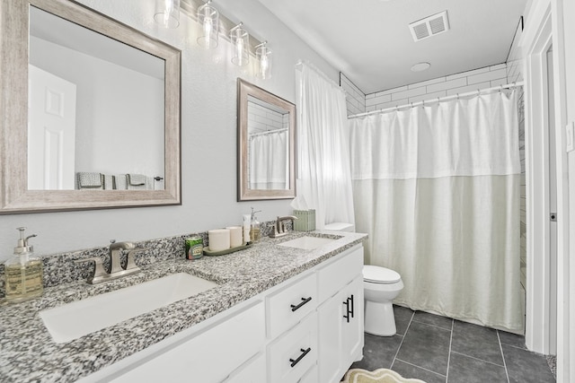 6338 Mecca St, Odessa, TX 79762 - bathroom with double vanity and tile patterned floors