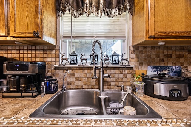 1703 Hemphill Ave, Odessa, TX 79763 - kitchen with brown cabinets and backsplash