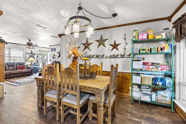 1703 Hemphill Ave, Odessa, TX 79763 - dining area featuring a textured ceiling, hardwood / wood-style flooring, a chandelier, ornamental molding, and ceiling fan