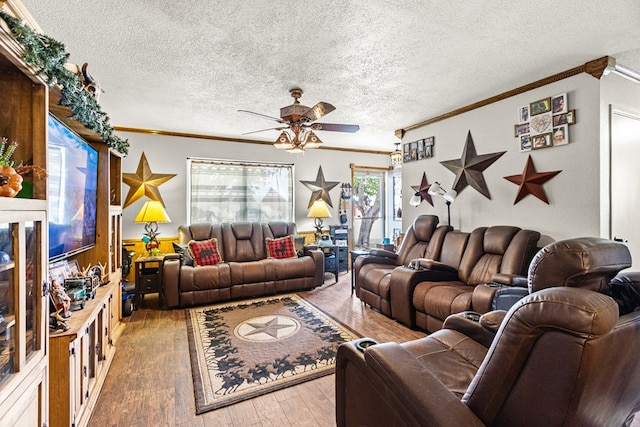 1703 Hemphill Ave, Odessa, TX 79763 - living room with ornamental molding, ceiling fan, hardwood / wood-style floors, and a textured ceiling