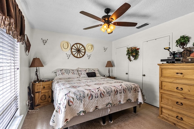 1703 Hemphill Ave, Odessa, TX 79763 - carpeted bedroom with a textured ceiling and ceiling fan