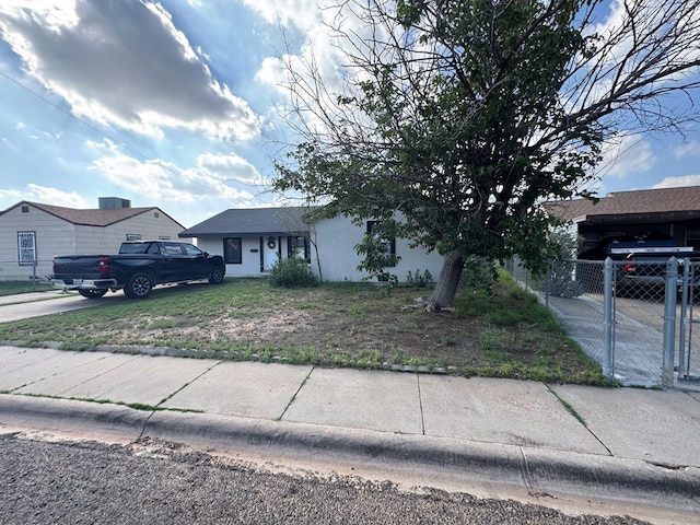2741 Keystone Dr, Odessa, TX 79762 - view of front of house featuring concrete driveway, a gate, and stucco siding