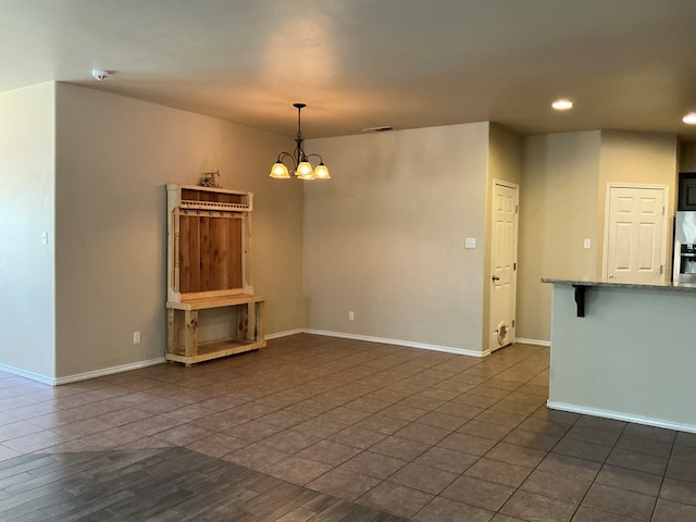 2804 Anice St, Odessa, TX 79762 - unfurnished living room with recessed lighting, a chandelier, baseboards, and dark tile patterned floors