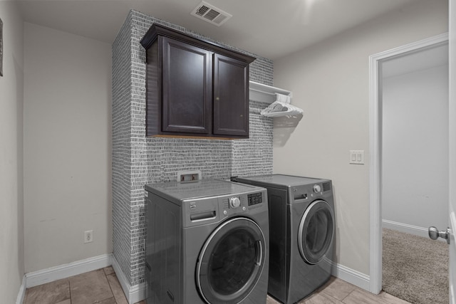 8901 Ratliff Ridge Ave, Odessa, TX 79765 - laundry area with cabinet space and washing machine and dryer