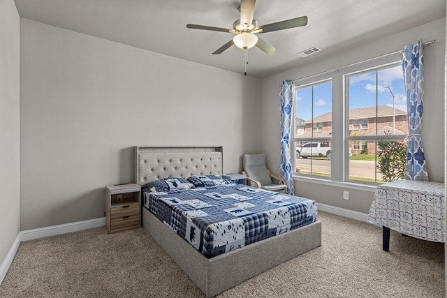 8620 Rutland Dr, Odessa, TX 79765 - bedroom with carpet, multiple windows, and ceiling fan