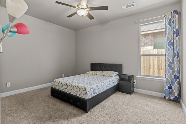 8620 Rutland Dr, Odessa, TX 79765 - carpeted bedroom featuring baseboards and a ceiling fan