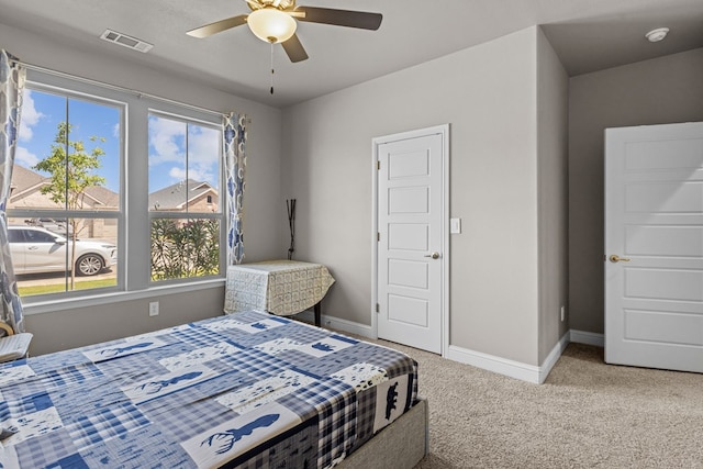 8620 Rutland Dr, Odessa, TX 79765 - carpeted bedroom featuring multiple windows and ceiling fan