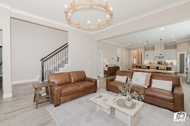 living room with crown molding, an inviting chandelier, light wood-style floors, stairs, and recessed lighting