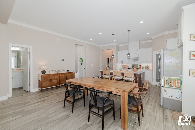 dining area with recessed lighting and light wood-style flooring