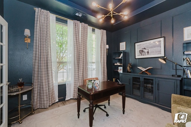 office featuring an inviting chandelier and visible vents