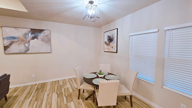 3630 El Cajon Ave, Odessa, TX 79765 - dining space with wood finished floors, baseboards, and a chandelier