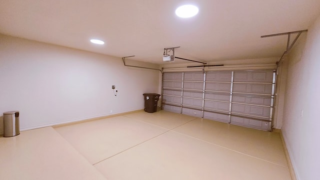 3630 El Cajon Ave, Odessa, TX 79765 - garage featuring a garage door opener, recessed lighting, and baseboards