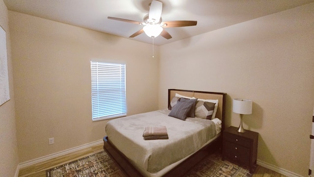 3630 El Cajon Ave, Odessa, TX 79765 - bedroom featuring baseboards, wood finished floors, and ceiling fan
