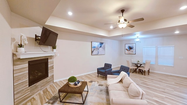 3630 El Cajon Ave, Odessa, TX 79765 - living room with light wood-style floors, baseboards, a tray ceiling, recessed lighting, and ceiling fan