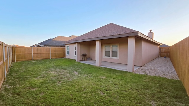 3630 El Cajon Ave, Odessa, TX 79765 - rear view of property featuring roof with shingles, a chimney, stucco siding, and a patio