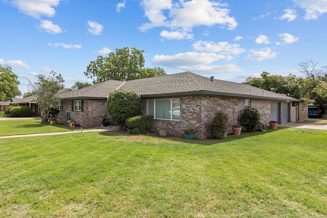 2900 E 21st St, Odessa, TX 79761 - single story home with a garage, brick siding, driveway, and a front yard