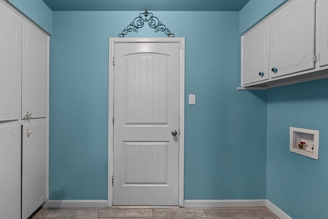 2900 E 21st St, Odessa, TX 79761 - clothes washing area featuring cabinet space, hookup for a washing machine, and baseboards