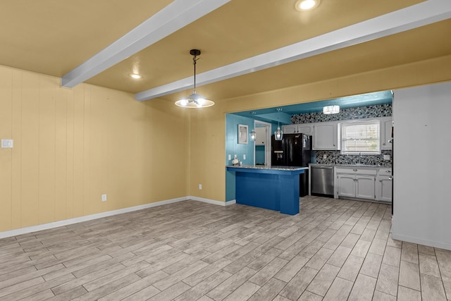2900 E 21st St, Odessa, TX 79761 - kitchen featuring dishwasher, a peninsula, beam ceiling, light wood-style floors, and decorative light fixtures